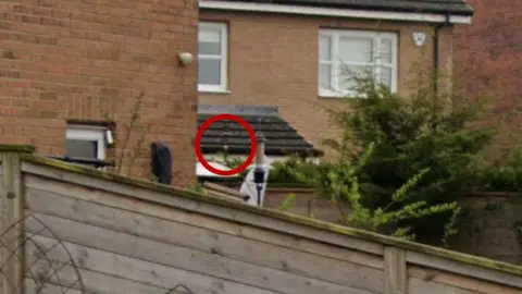 Google A Google Map close-up of the weather station in the garden. There is a red circle around it. 