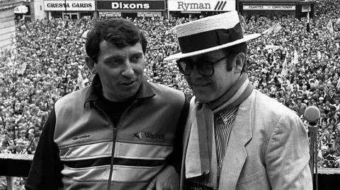 PA Media Graham Taylor and Elton John in 1984