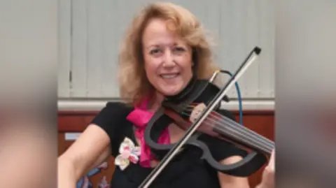 Silhouette Band Image shows a woman playing the viola. 