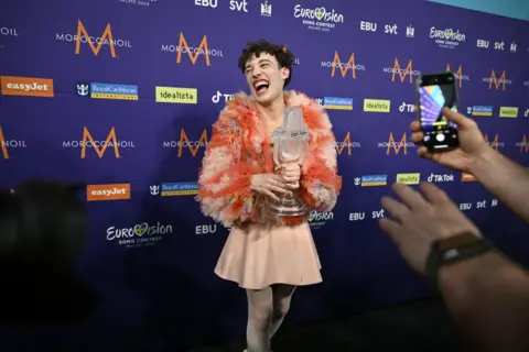 EPA Nemo celebrates backstage at the Eurovision Song Contest