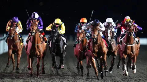 Blues and Royals ridden by Hector Crouch (third right) on their way to winning the Virgin Bet A Good Bet Handicap at Kempton Park Racecourse, Sunbury-on-Thames. Picture date: Wednesday March 25, 2026. 