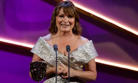 Getty Images Lorraine Kelly accepts the Special Award onstage during the 2024 BAFTA Television Awards with P&O Cruises at The Royal Festival Hall on May 12, 2024 in London, England.