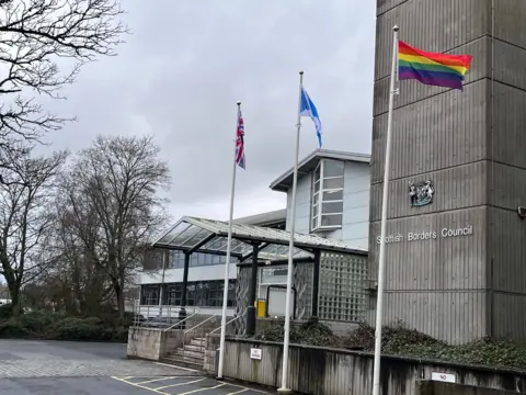 Three flags outside Scottish Borders Council's headquarters - a Union Jack, the Scottish saltire and the rainbow flag