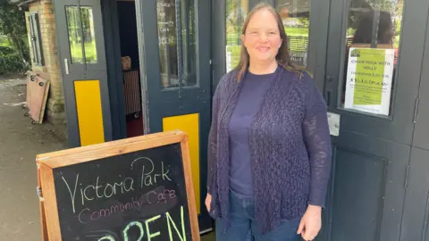 Sam Evans from community group Prosper Frome standing outside a shop in Frome.