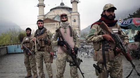 Four members of the Taliban security forces holding guns in Kabul on 19 March 2026