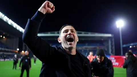 Coventry City manager Frank Lampard clenches his fist in the air in celebration