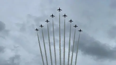 Walton Holymoorside School Red Arrow jets in triangular formation with white trails