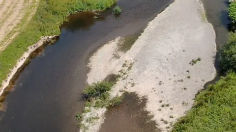 An aerial shot of the river seven, showing dried up parts of the embankment