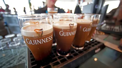 Pints of Guinness on a bar