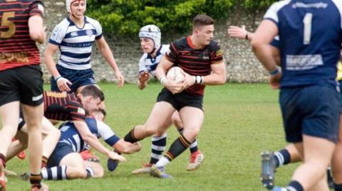 Noah Rees playing rugby