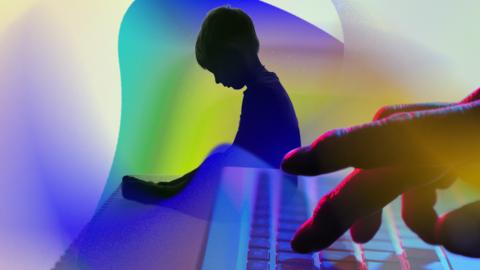 Image of child and hand on keyboard