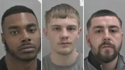 Deago Martin, Keelan Brookes and Kaine Simmonds. The three men each have a straight face in front of a grey background. Martin has black hair and a patchy black beard. Brookes has short light brown hair and stubble. Simmonds has short dark hair and a thick dark beard.