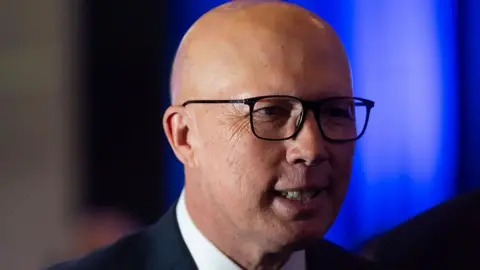 Liberal opposition leader Peter Dutton against a blue screen 