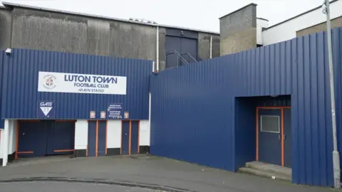 DJ McLaren/BBC The entrance to the main stand at Kenilworth road.