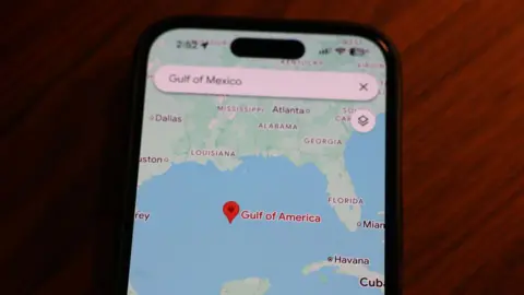 Getty Images A phone screen showing Google maps with the "Gulf of America" labelled as the location.