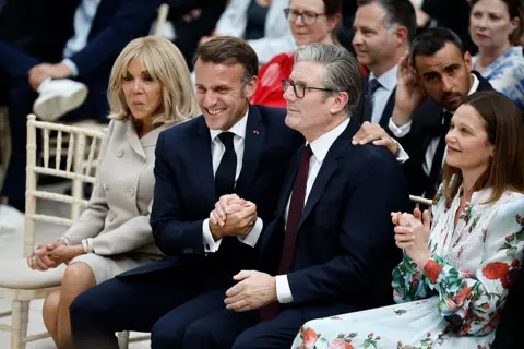 Getty Images France's President Emmanuel Macron sat with with Keir Starmer during a visit to The British Museum in London, on July 9, 202