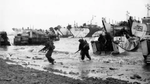 EPA Black and white image showing troops disembarking from landing craft on the beaches of Normandy during the invasion of France on June 6, 1944 