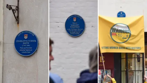 Chichester City Council A composite image shows three blue plaques. The first plaque, mounted on a light‑coloured stone wall, commemorates Charlotte Turner Smith. The second plaque is mounted on a white brick wall and commemorates Margery Wilkinson. The third plaque for Queen Elizabeth I is mounted above a shop front, partly visible behind a yellow banner held up in the foreground.
