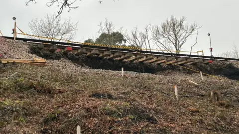 Network Rail A view of the embankment from below, which shows the tracks in the air