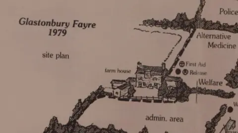 A map with black and white drawings of farm houses. It says Glastonbury Fayre 1979 site plan on the side of the drawings.