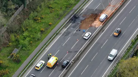 An aerial view of the vehicle fire which has closed the A23