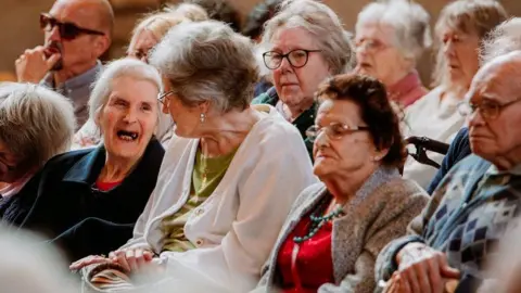 An audience of care home residents