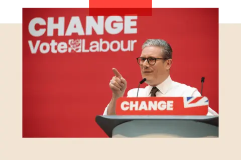 Labour's Keir Starmer speaking in front of a sign that reads "Change Vote Labour"