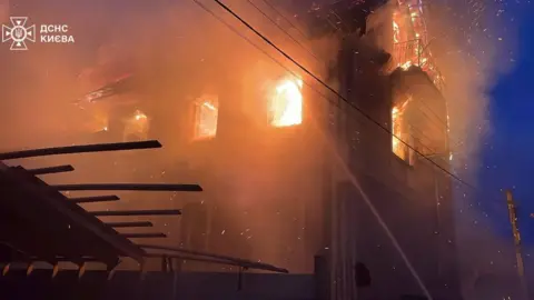 Ukraine's state emergencies service DSNS A house is burning in Kyiv following a Russian aerial attack. Photo: 27 December 2025