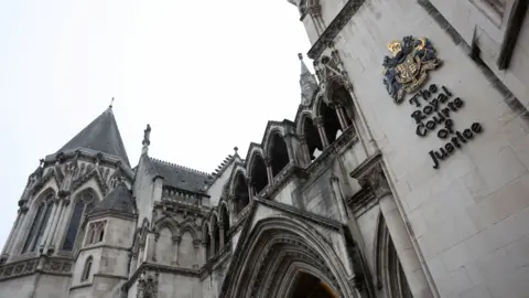  The Royal Courts of Justice. A grand, stone building.