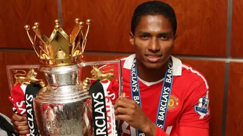 Antonio Valencia holds the Premier League trophy