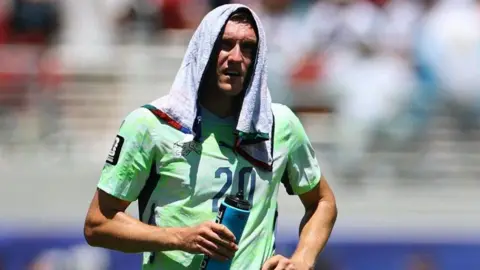 Switzerland's Michel Aebischer during a hydration break at the 2026 World Cup