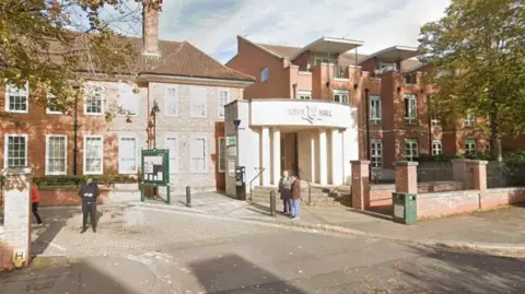 Google A large brown brick building