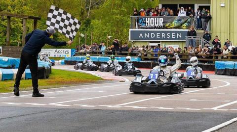 Karters taking the chequered flag at Buckmore Park