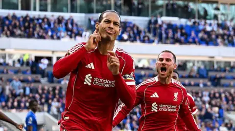Van Dijk celebrates scoring against Everton