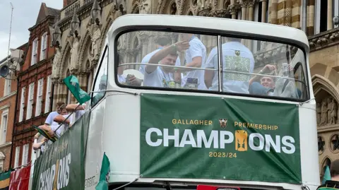 Harriet Heywood/BBC Northampton Saints players wave farewell to fans