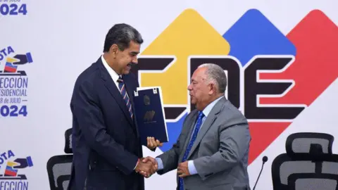 Getty Images Nicolas Maduro, Venezuela's president, left, and Elvis Amoroso, president and rector of the National Electoral Council (CNE), attend a press conference to certify the presidential election at the National Electoral Council (CNE) in Caracas, Venezuela, on Monday, July 29, 2024. 