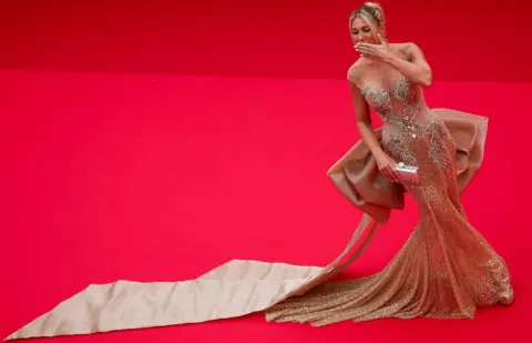 Reuters Hofit Golan poses on the red carpet during arrivals for the opening ceremony and the screening the film "Le deuxieme acte" (The Second Act) Out of competition at the 77th Cannes Film Festival in Cannes, France, May 14, 2024