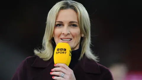 Getty Images Gabby Logan holding a BBC Sport microphone