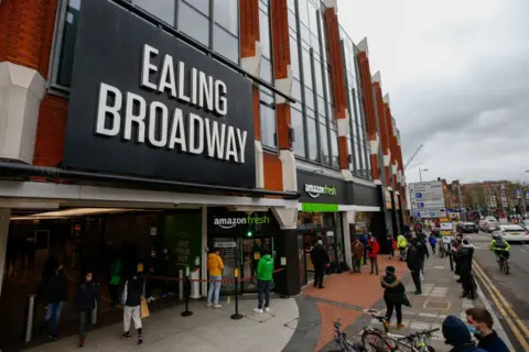An Amazon Fresh cashierless convenience store in the Ealing area, on a busy shopping street. 