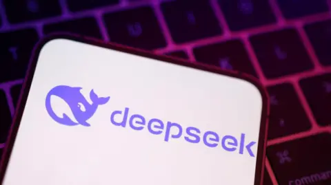 A phone screen with the DeepSeek logo, a cartoon purple whale.