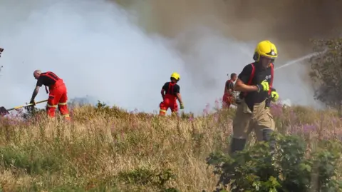 Firefighters tackling the blaze at Headon Warren.