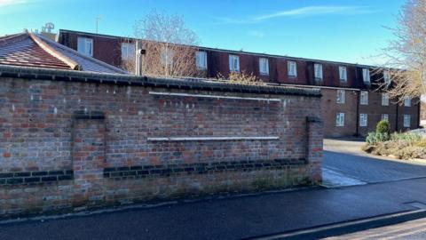 A wall and entrance for the Old Palace Lodge, Dunstable