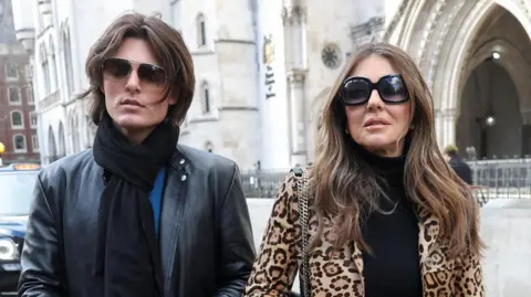 Reuters Elizabeth Hurley and her son Damian outside the Royal Courts of Justice