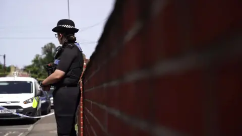 Jonny Michel/BBC Police officer at Bury Road in Thetford