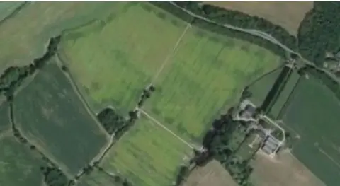 Elevns Aerials Comp An aerial photograph shows the farmland the digester would be built on. 