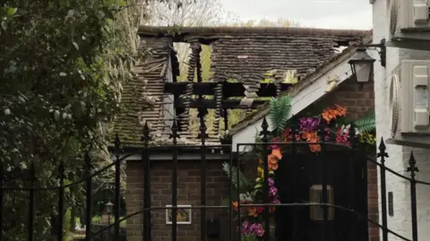 The roof of a restaurant damaged by fire.