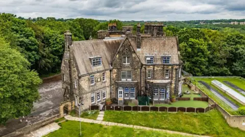 A Victorian property surrounded by lawns