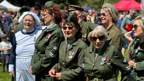 Women dressed in military attire at Alsager Carnival