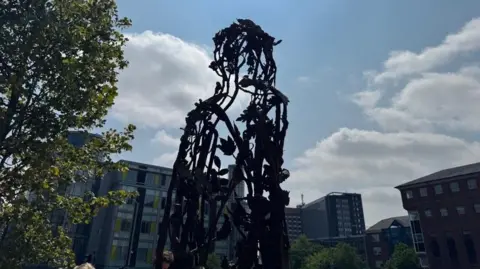 A bronze silhouette sculpture of the legendary Robin Hood heroine Maid Marian. 
