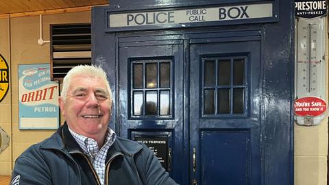 Andrew Hardy standing in front of Tardis 